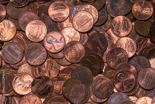 Copper pennies in a pile from top view