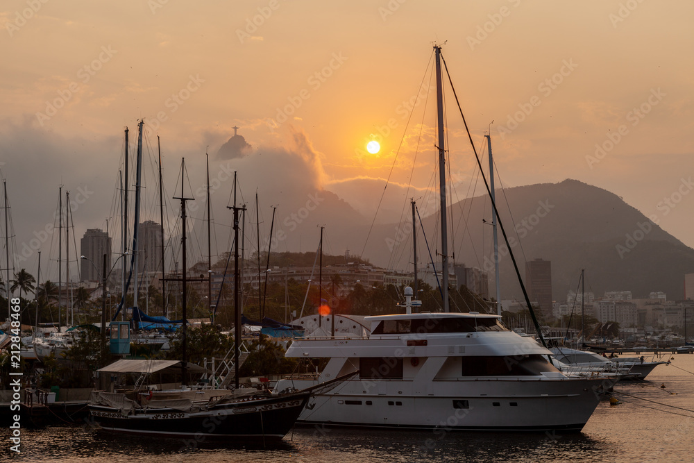 City harbour in Rio de Janeiro with the Christ statue in the background at sunset