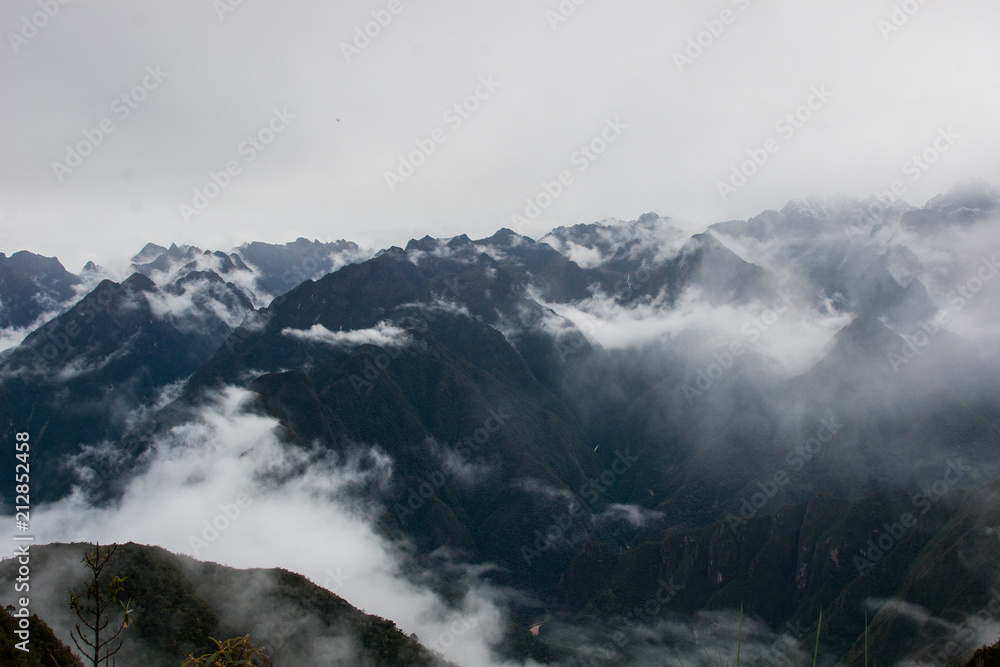 Panoramic inspirational view of the Andes mountains in mist on the Inca Trail. Peru. South America. No people. Panoramic inspirational view of the Andes mountains in mist on the Inca Trail. Peru. South America. No people.