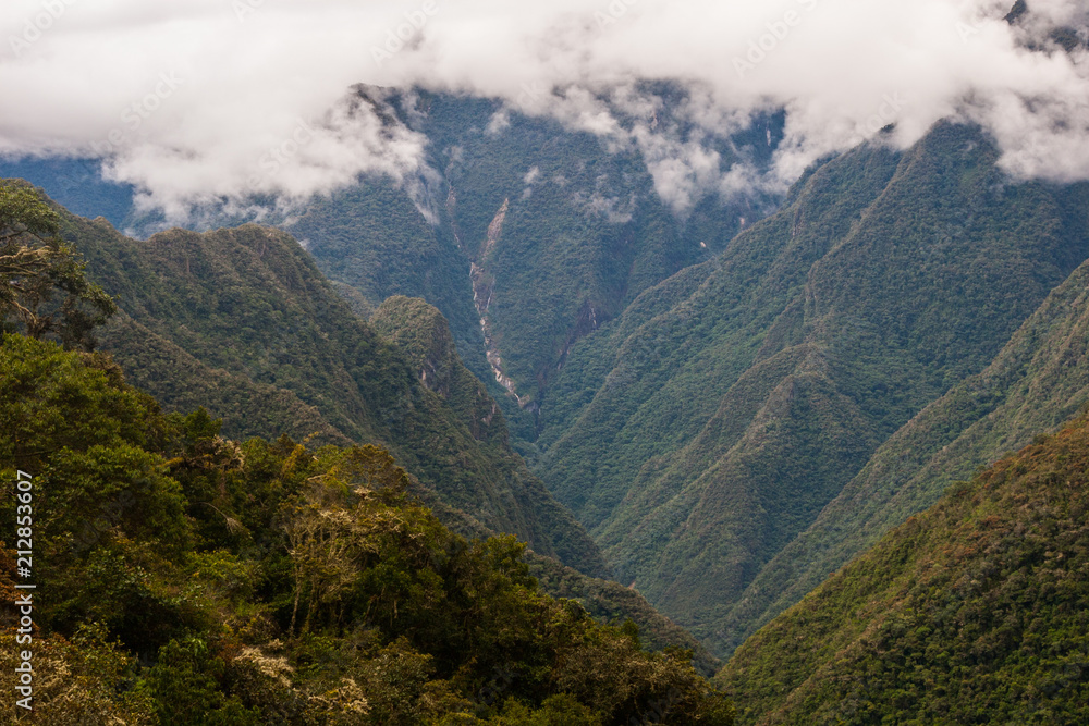 Clouds over the green valley of the Andes in Peru along the Inca Trail. South America. No people.