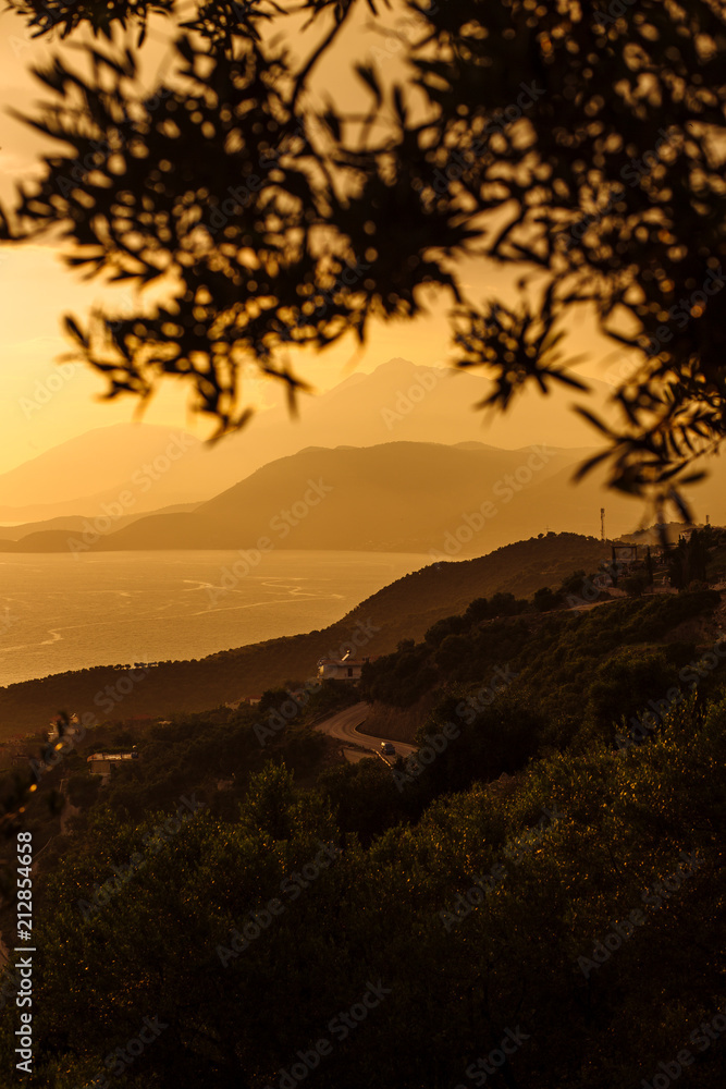 Fototapeta premium Beautiful view from the hill overlooking the sea and mountains, Albania, the Ionian Sea. Sunset