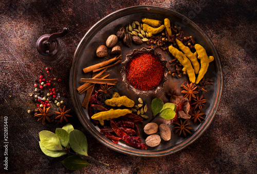 Fototapeta Naklejka Na Ścianę i Meble -  Indian spices and herbs on a dark concrete background