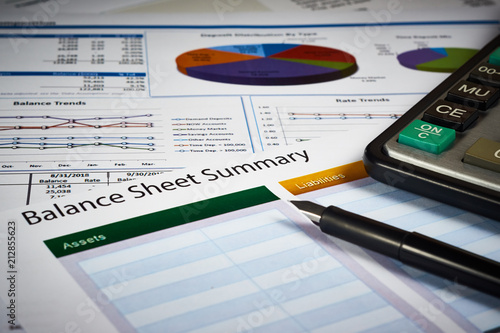 balance sheet summary and balance sheets with calculator and pen