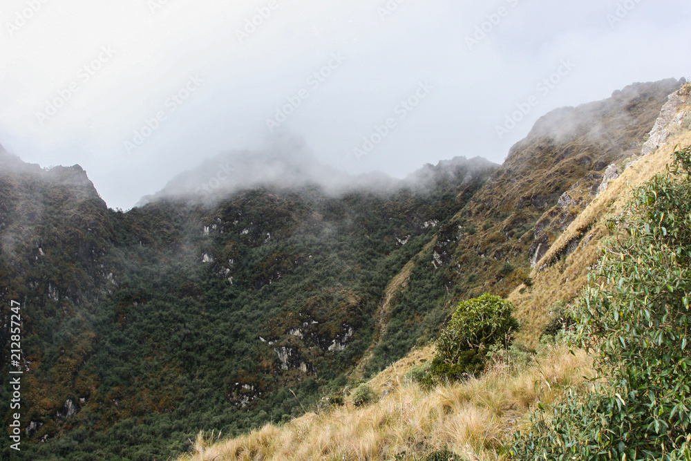 Panoramic view from the Inca Trail of the Andes with intense low clouds. Peru. South America. No people.
