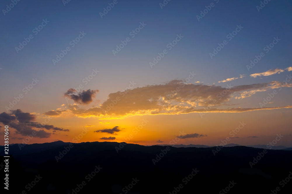 landscape of clouds sky sunset over mountains