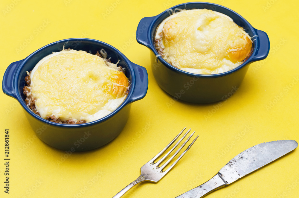 Buckwheat porridge with cheese and egg on yellow background. Healthy food. Buckwheat porridge with cheese and egg on yellow background. Healthy food.