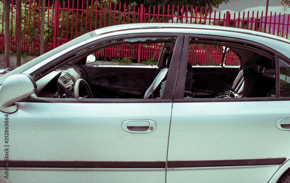 A criminal incident. Hacking the car. Broken side window of a car A criminal incident. Hacking the car. Broken side window of a car