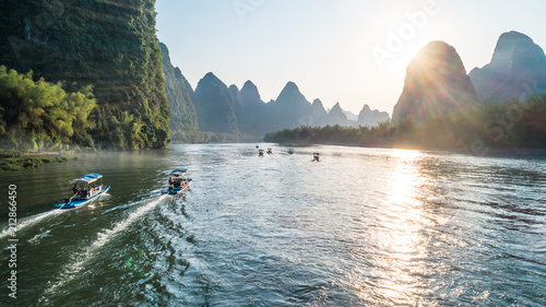bamboo boat moving at Li River during sunset time