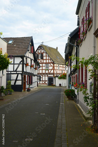 old small German town on the river bank narrow streets  pavement flowers on the windows