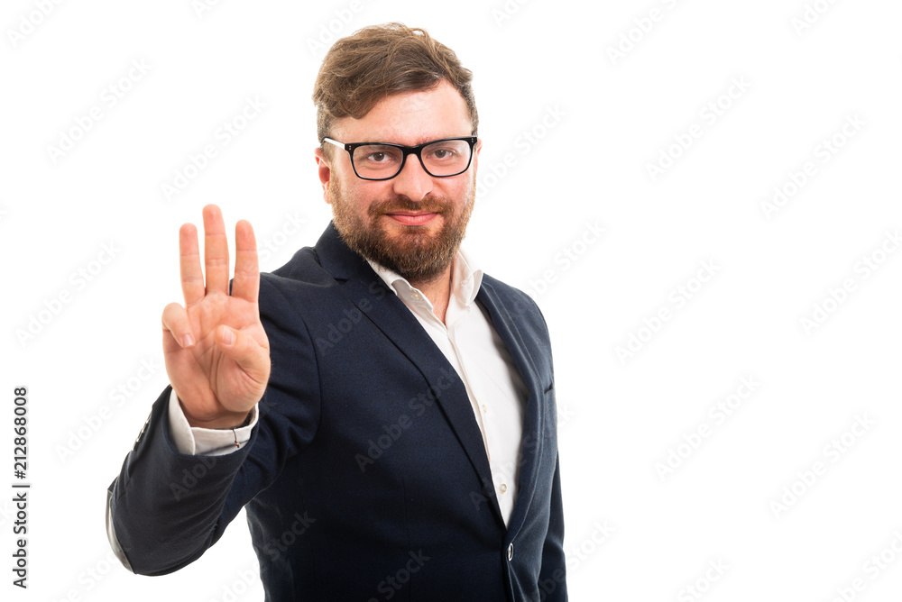 Portrait of business man showing number three with fingers Portrait of business man showing number three with fingers