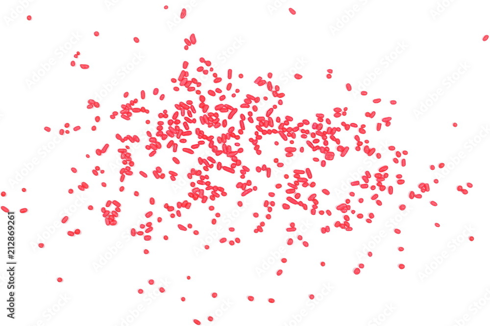 Red chocolate sprinkles, granules isolated on white background and texture, top view Red chocolate sprinkles, granules isolated on white background and texture, top view