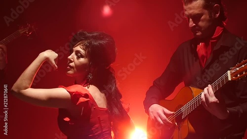 Wallpaper Mural Flamenco. Dancer performs movements with her hands to the music on the guitar. Light from behind. smoke background. Slow motion Torontodigital.ca
