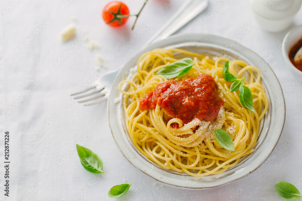 Pasta dish with tomato sauce on white plate Pasta dish with tomato sauce on white plate