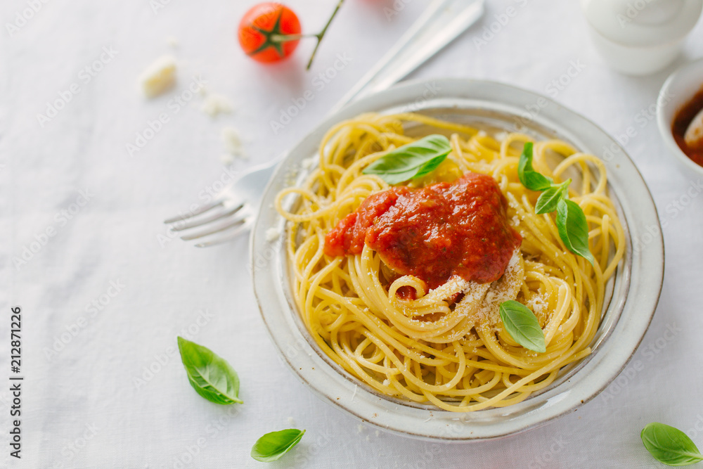 Pasta dish with tomato sauce on white plate