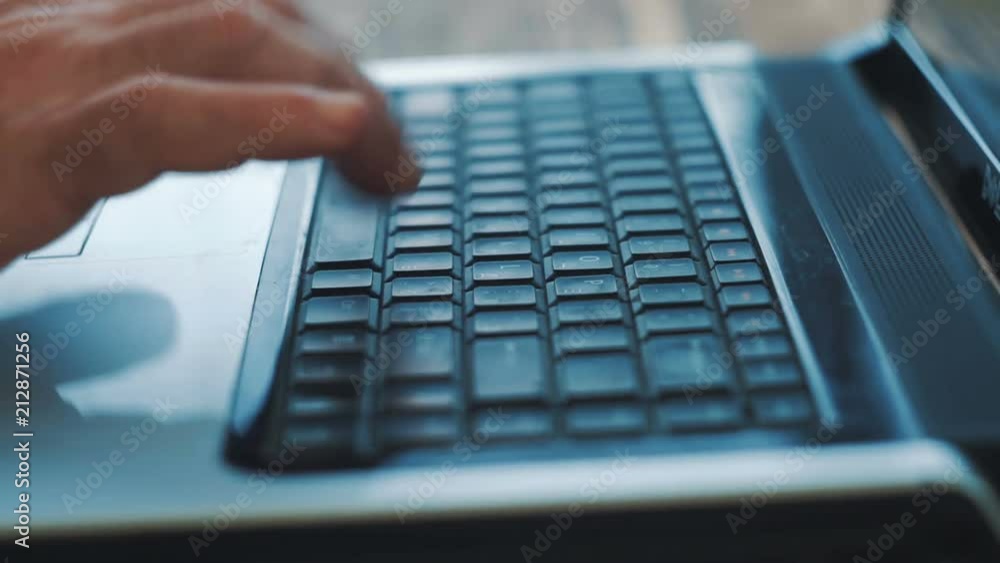 Man Fingers Taping Keyboard Notebook Computer. Close up. Man Fingers Taping Keyboard Notebook Computer. Close up.
