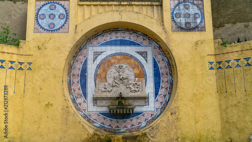 A historic fountain located inside Quinta da Regaleira, Sintra, Portugal photo