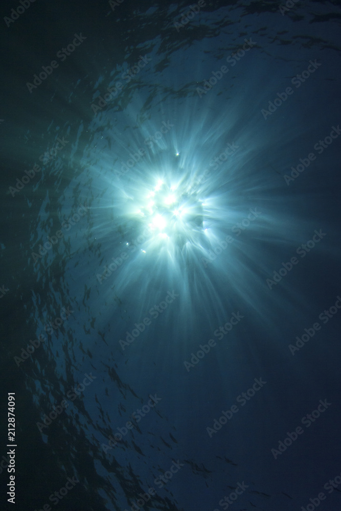 Blue sea water background and sunburst Blue sea water background and sunburst