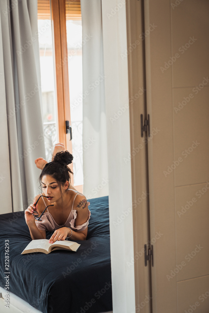Alluring woman with eyeglasses and book Alluring woman with eyeglasses and book