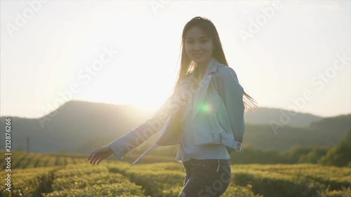 Wallpaper Mural Smiling and carefree female model posing and having a nice time on walk on mountain plantation during summertime. Happy woman in fashionable outfit. Torontodigital.ca