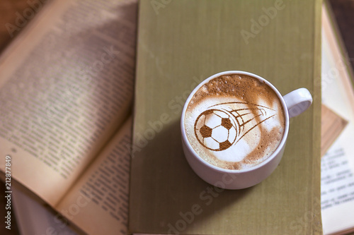 Coffee cappuccino in a cup for breakfast for a football fan photo