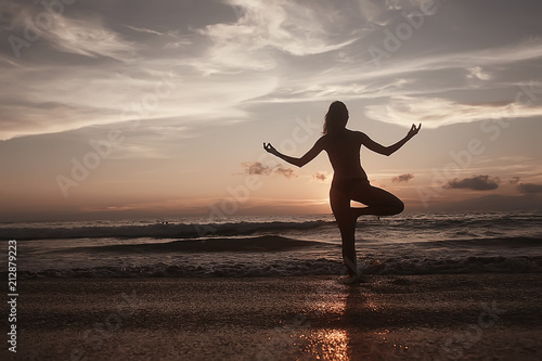meditation and yoga on the beach   summer vacation concept health beauty  summer vacation yoga classes on the sea shore