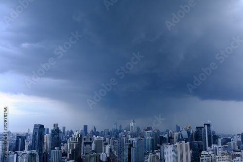rain clouds over city  aerial cityscape  residential buildings and business skyscraper