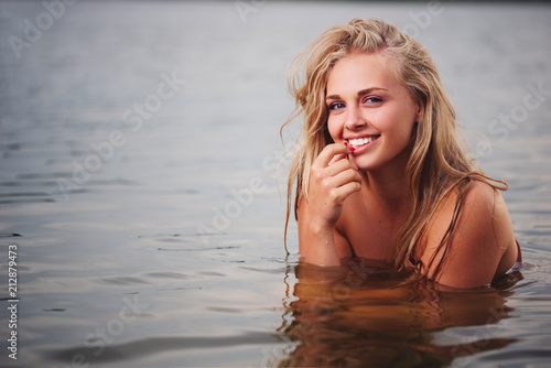 beautiful blonde girl in water