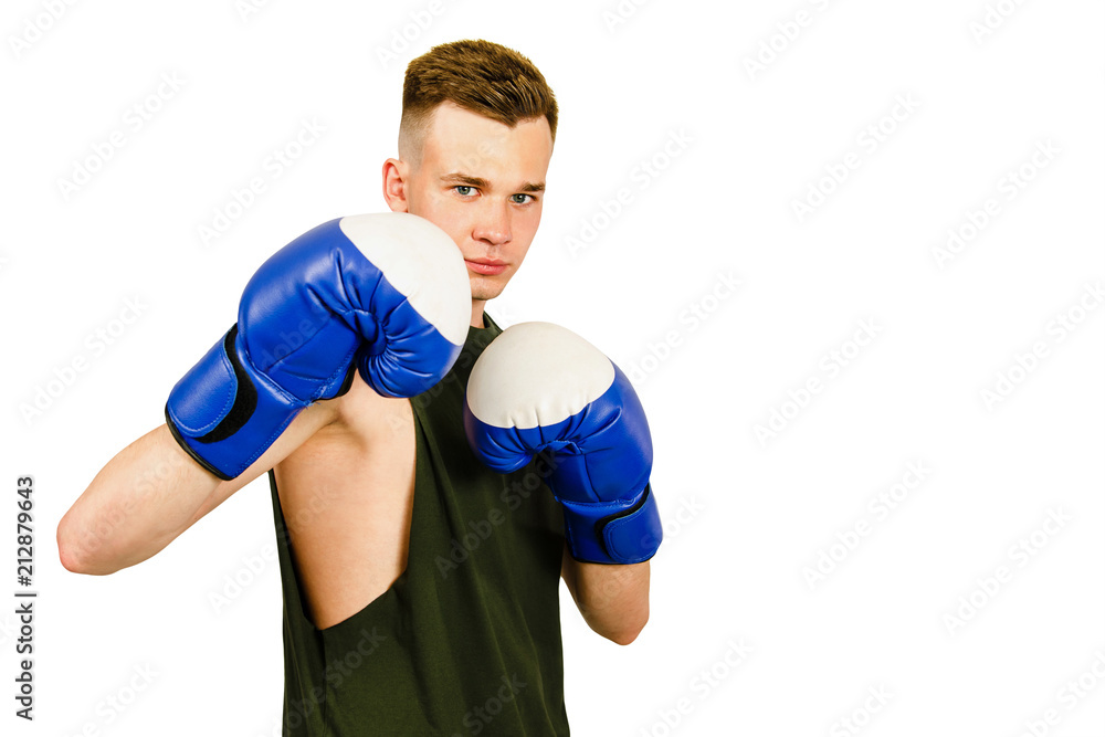 Young guy boxer in blue boxing gloves isolated on a white background.