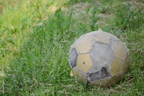 Old ball on grass