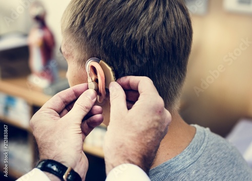 A man having his ears checked