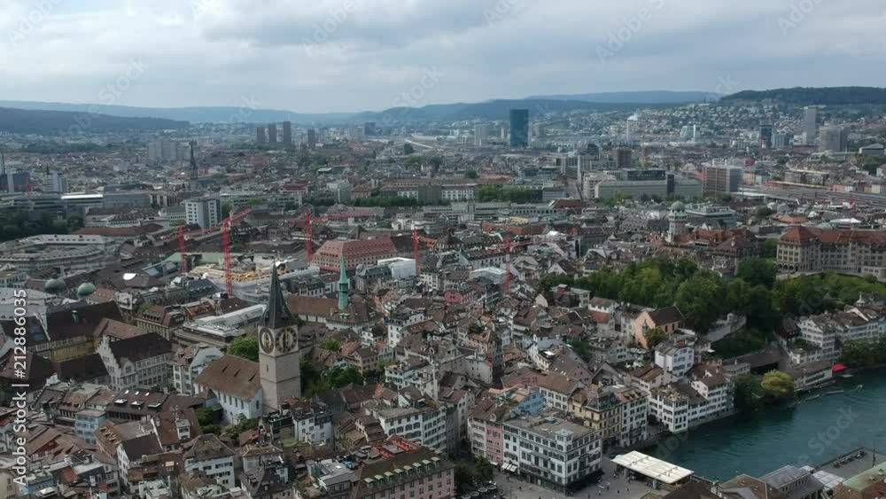 drone slow backwards flight over Zürich, Switzerland revealing the cityscape on a warm summer day drone slow backwards flight over Zürich, Switzerland revealing the cityscape on a warm summer day