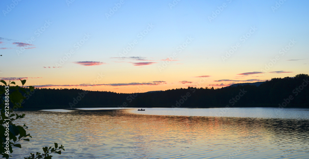 Panorama of an bohemian lake near Cheska Lipa with a boat