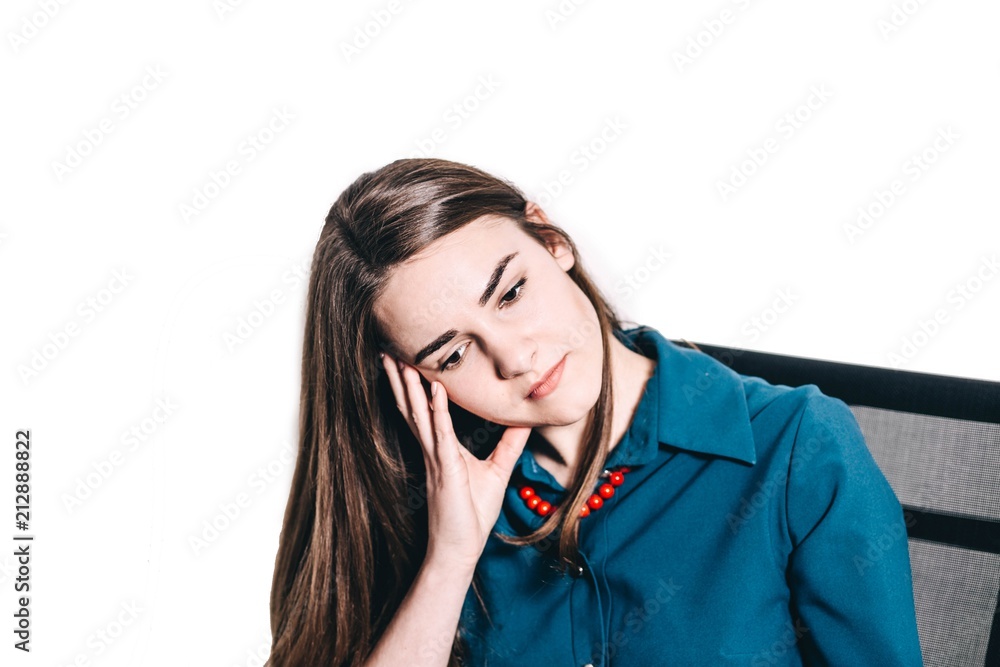 tired smiling woman manager sitting in armchair and propping his head against a white background. concept of work in the office. tired smiling woman manager sitting in armchair and propping his head against a white background. concept of work in the office.