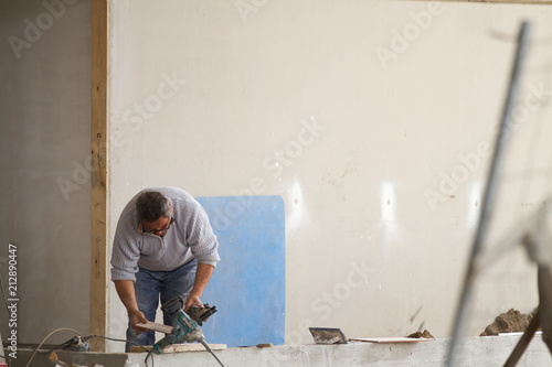 bricklayer at work in a building site