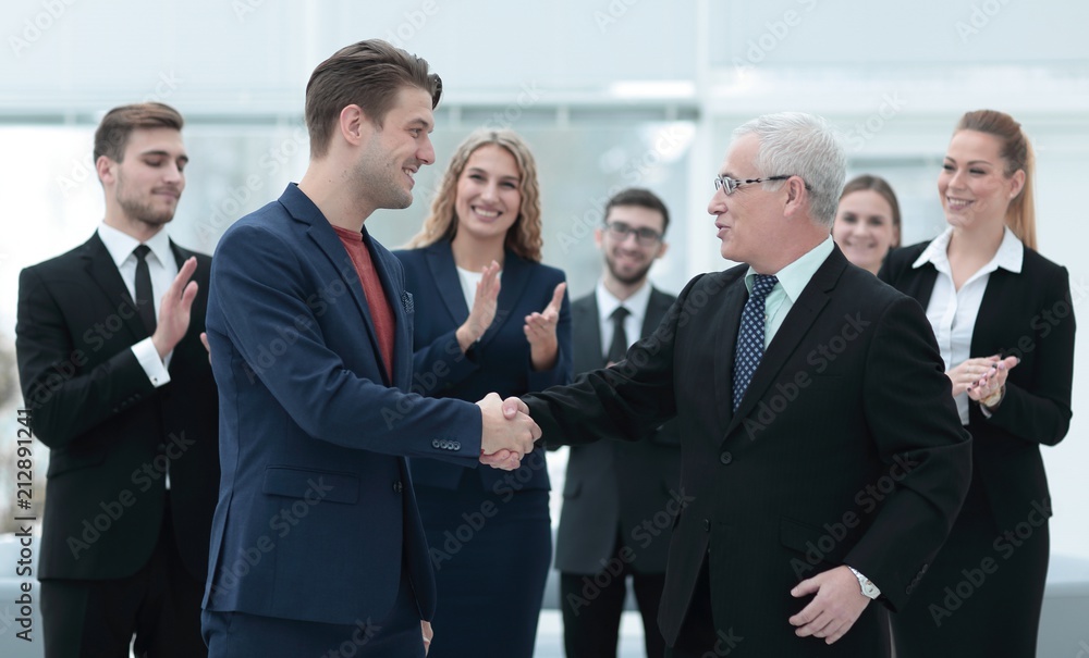 handshake of business partners after a business meeting in the office handshake of business partners after a business meeting in the office