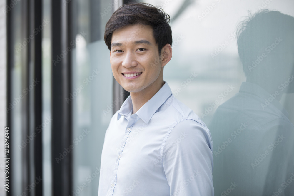 Portrait of cheerful young Chinese businessman Portrait of cheerful young Chinese businessman