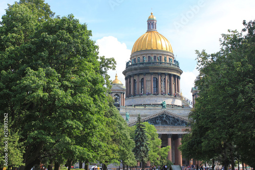 Saint Isaac's Cathedral Facade and Golden Dome in St. Petersburg, Russia. Famous Christian Cathedral on Sunny Summer Day, View from City Park. Saint Isaac's Cathedral Monumental Architecture Image.