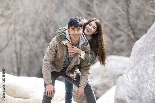 Portrait of happy young Chinese couple outdoors in winter