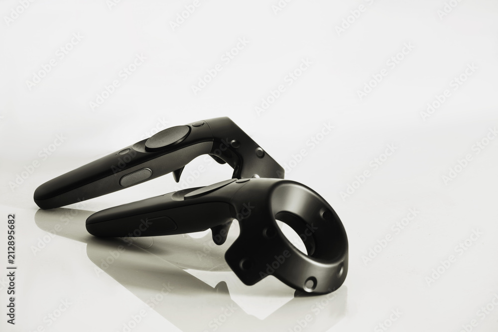 A closeup of a virtual reality controllers on a white background A closeup of a virtual reality controllers on a white background