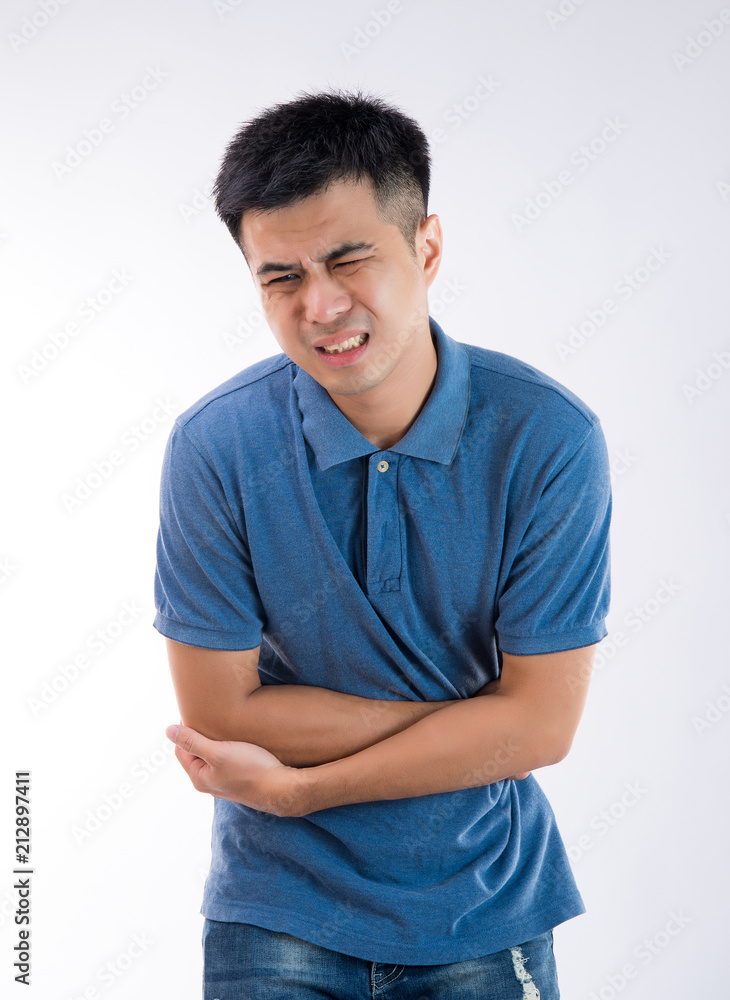 Man putting his hands for belly or stomach ache on white background Man putting his hands for belly or stomach ache on white background