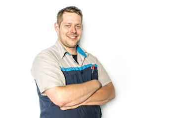 Handsome auto mechanic on white background
