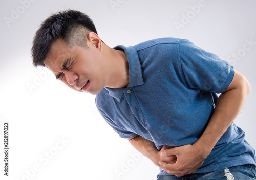 Photos young man having a stomachache