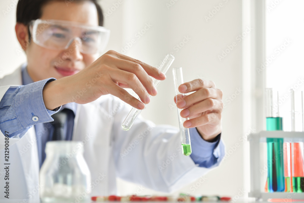 Research Scientist is Using Micropipette Filling Test Tubes.