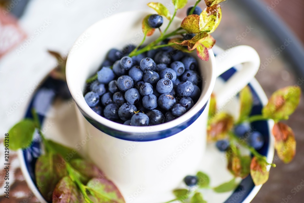 Blueberries in small cup. Blueberries in small cup.