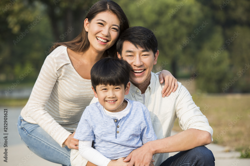Portrait of cheerful young Chinese family Portrait of cheerful young Chinese family