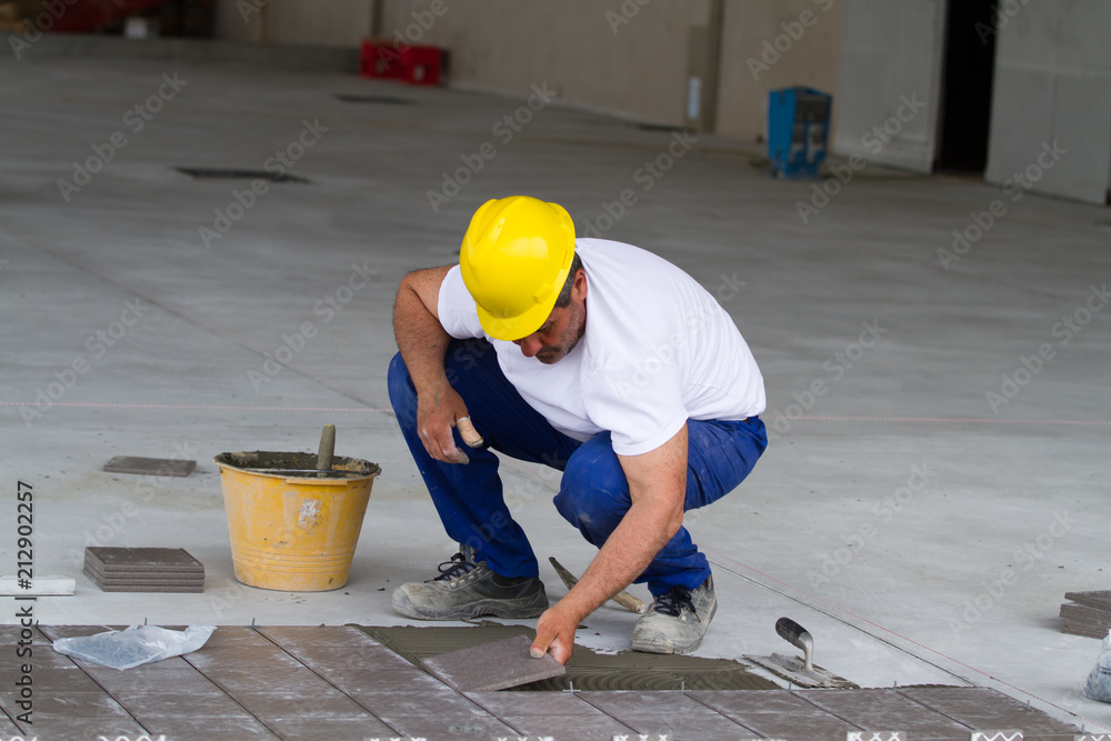bricklayer at work in building site