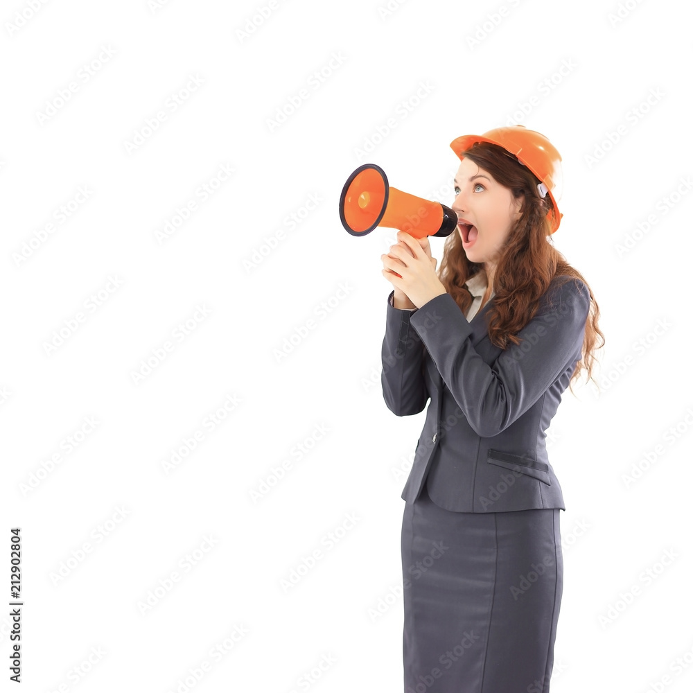 confident female architect - engineer shouts into a megaphone a megaphone. confident female architect - engineer shouts into a megaphone a megaphone.