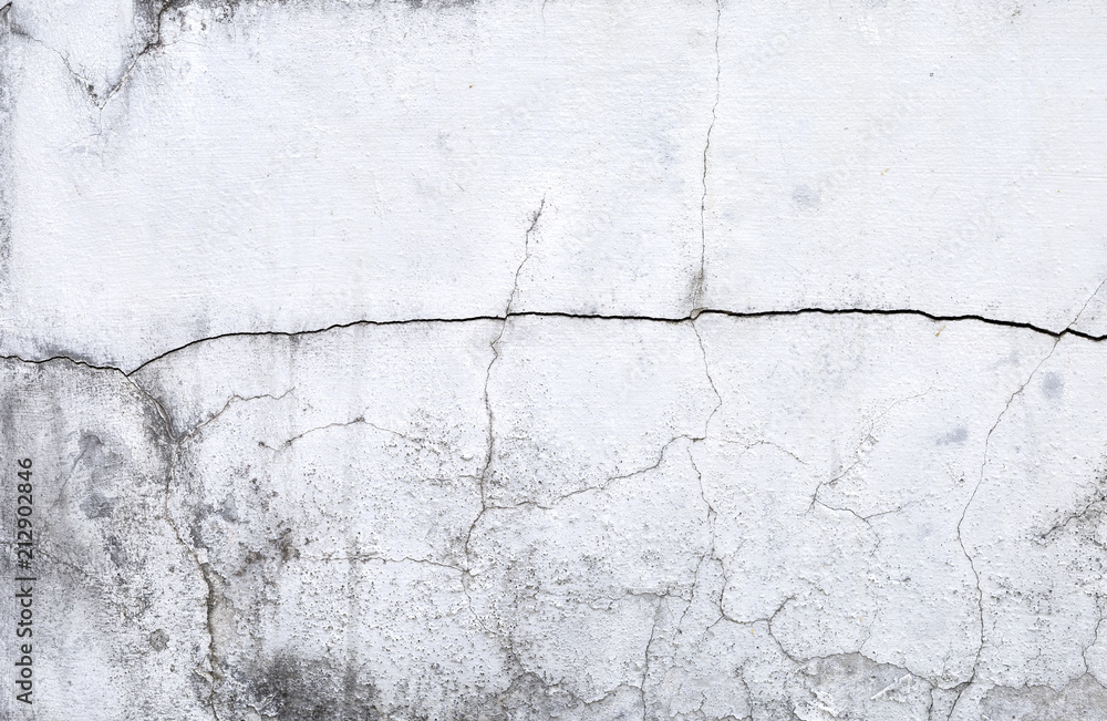 Obraz premium Crack texture on white old cement wall background, construction concept background 