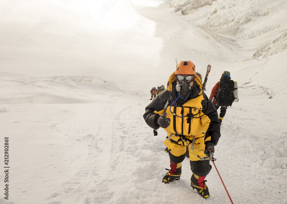 Roped mountaineers wearing oxygen masks Stock Photo Adobe Stock
