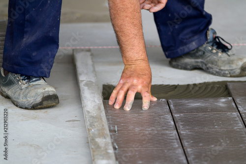 bricklayer at work in building site © franco lucato